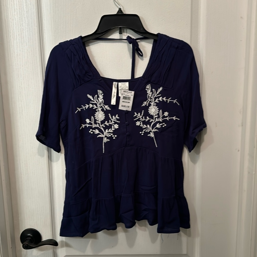 NWT. Gorgeous blue work appropriate top with white floral embroidery. Medium